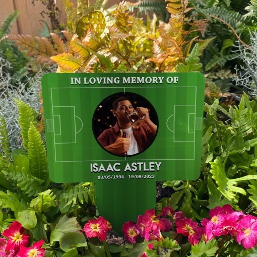 Football Pitch background with your chosen image inserted in a circle memorial stake inserted in flower bed surrounded by colourful flowers in the garden