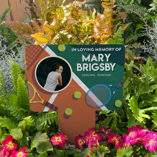 Tennis court background with your chosen image inserted in a circle memorial stake inserted in flower bed surrounded by colourful flowers in the garden